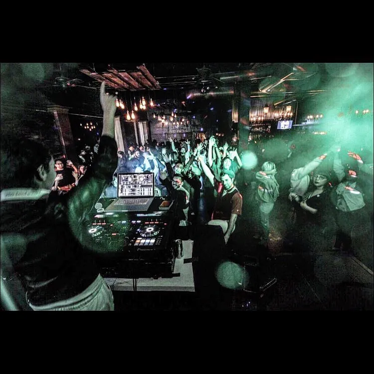 Club crowd in teal light