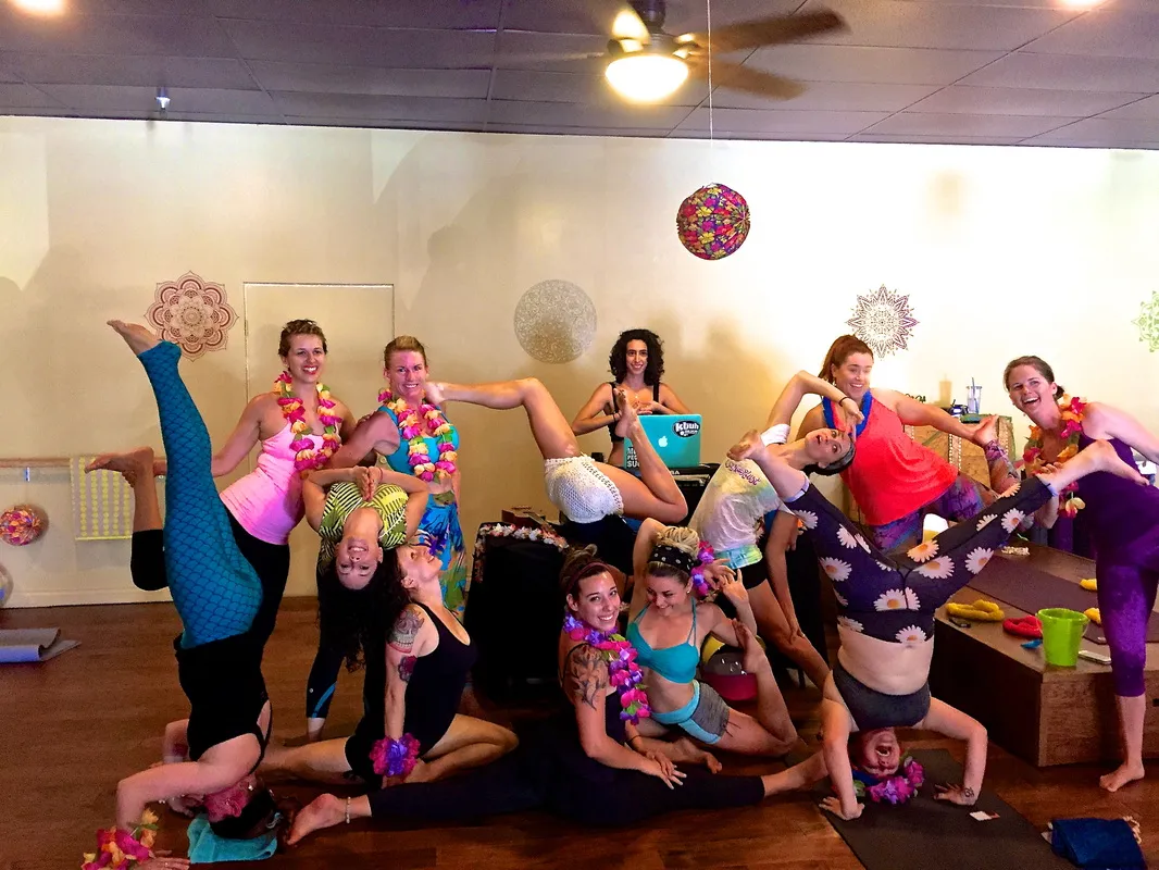 A studio full of guests striking a pose